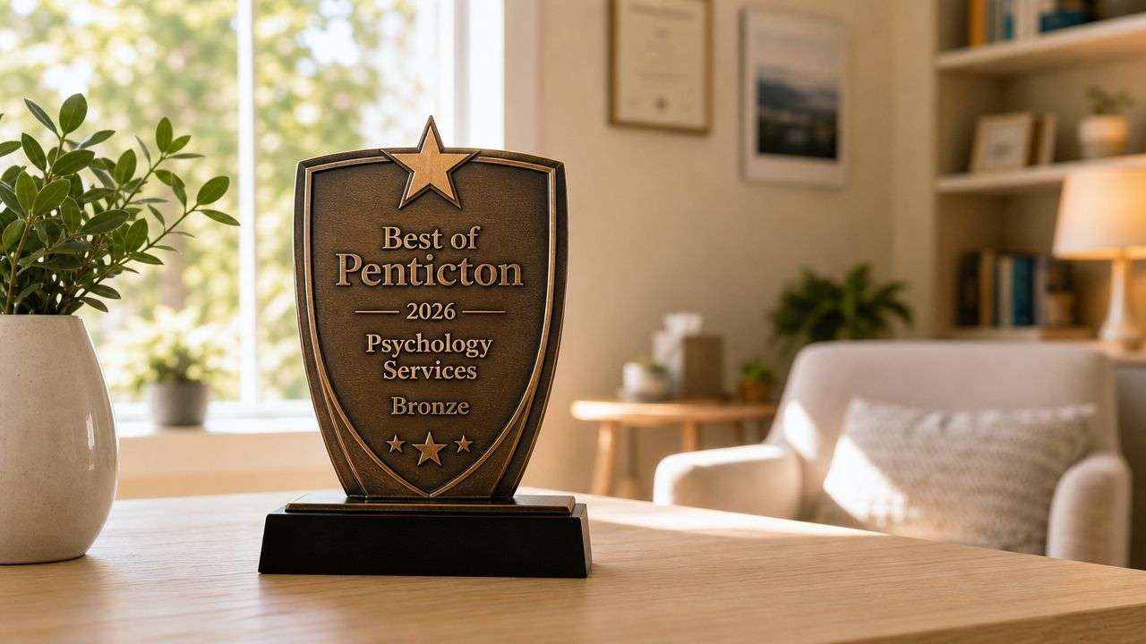 A bronze award trophy for Best of Penticton 2026 for Psychology Services displayed on a desk.
