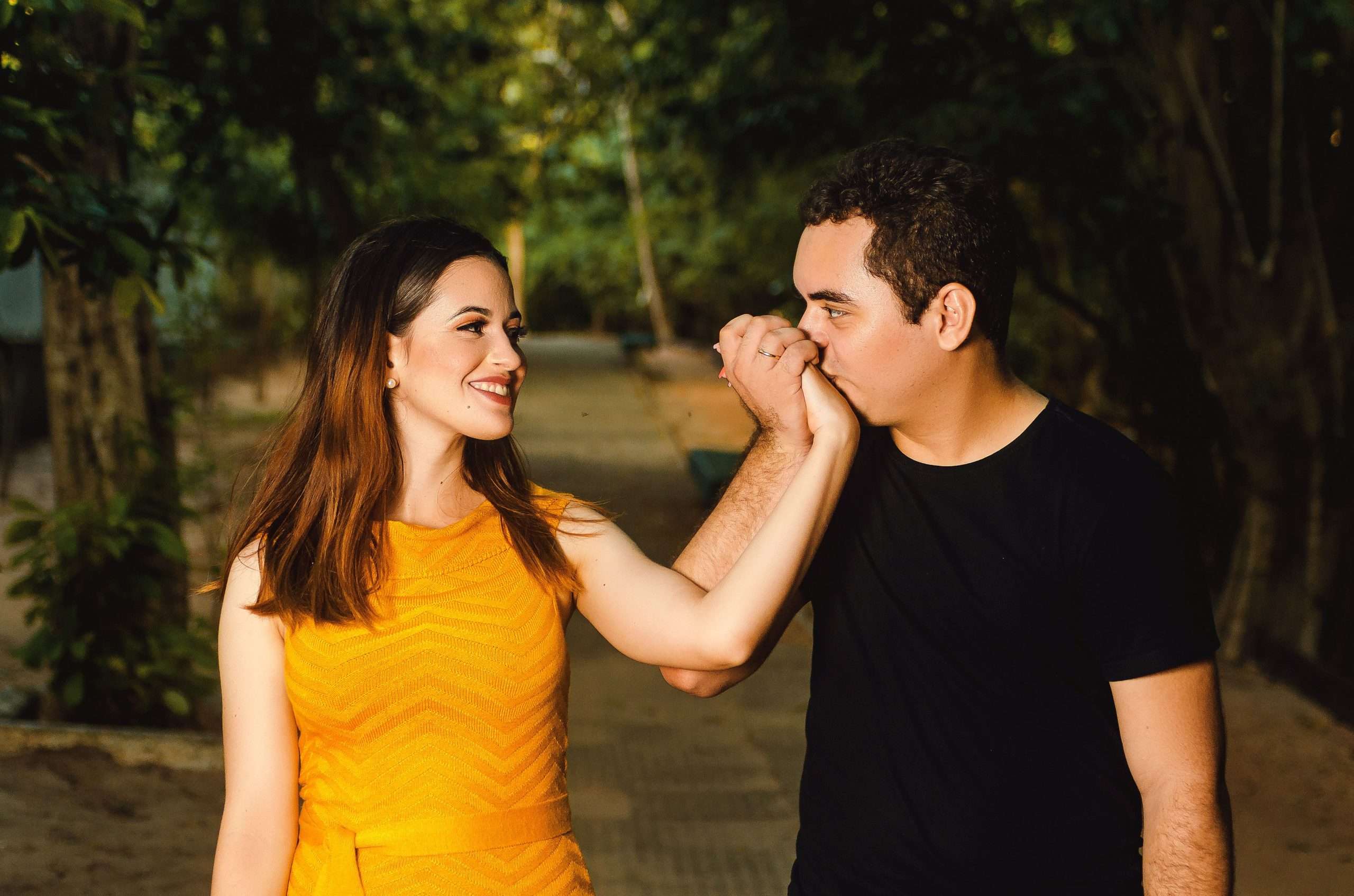 couples therapy exercises for emotional intimacy - A loving couple shares a tender moment outdoors, symbolizing romance and connection.