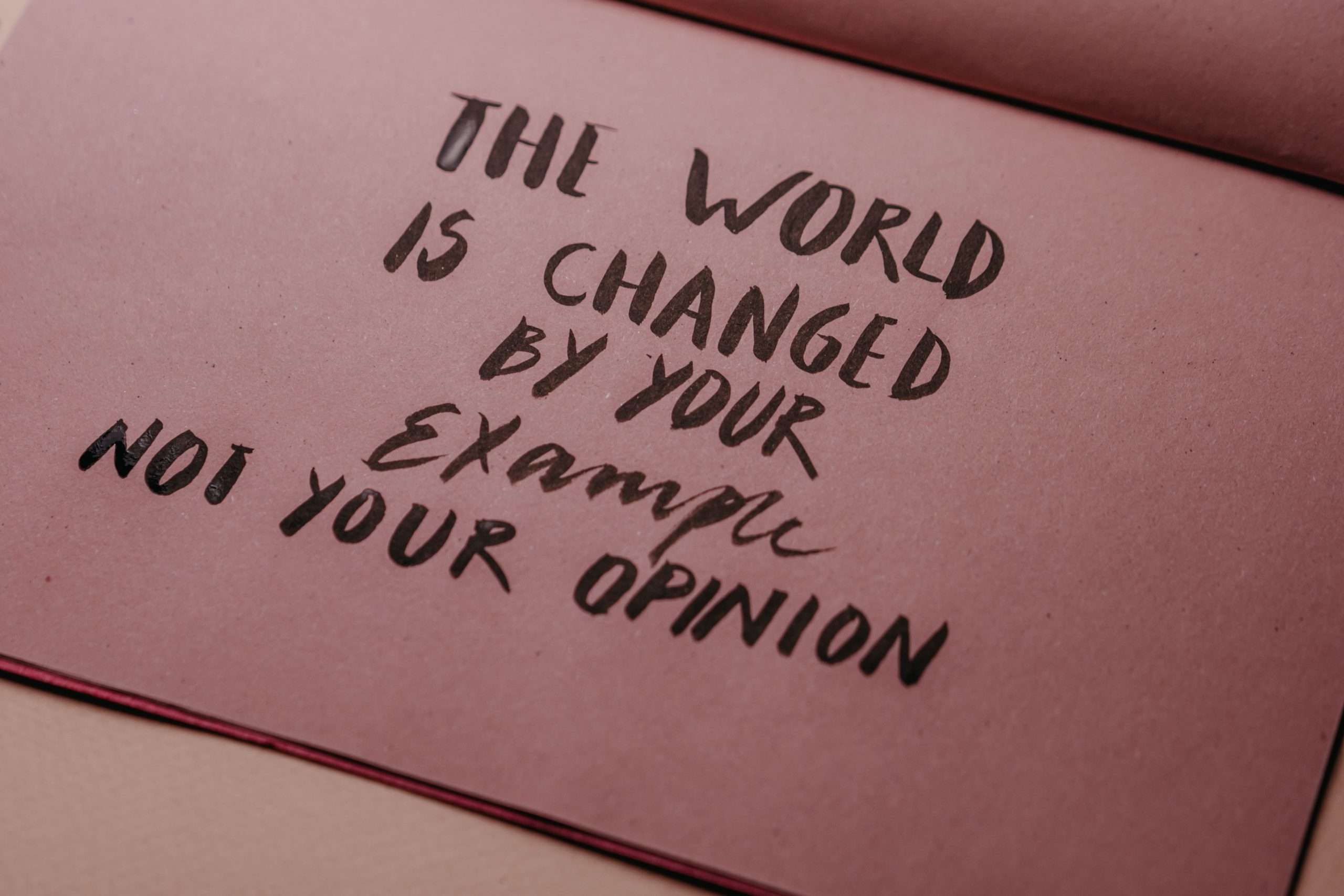 examples of love language - Motivational phrase emphasizing actions over words displayed on textured paper.